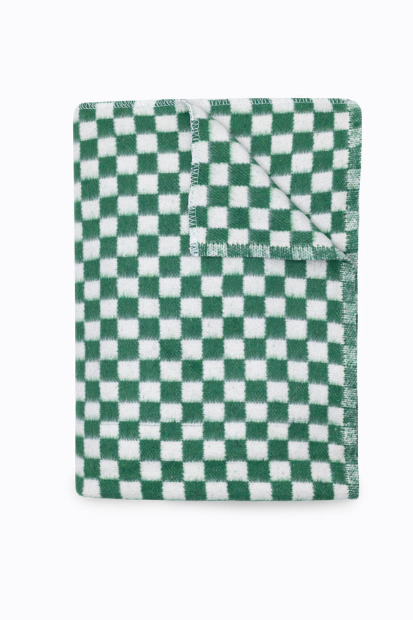 Folded green and white checkered blanket