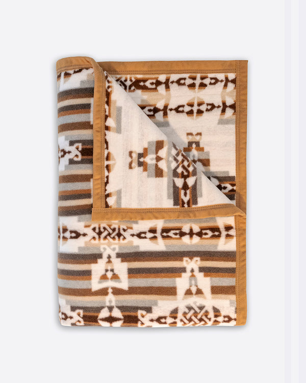 Folded on reverse with brown and beige stripes, showing the corner of white