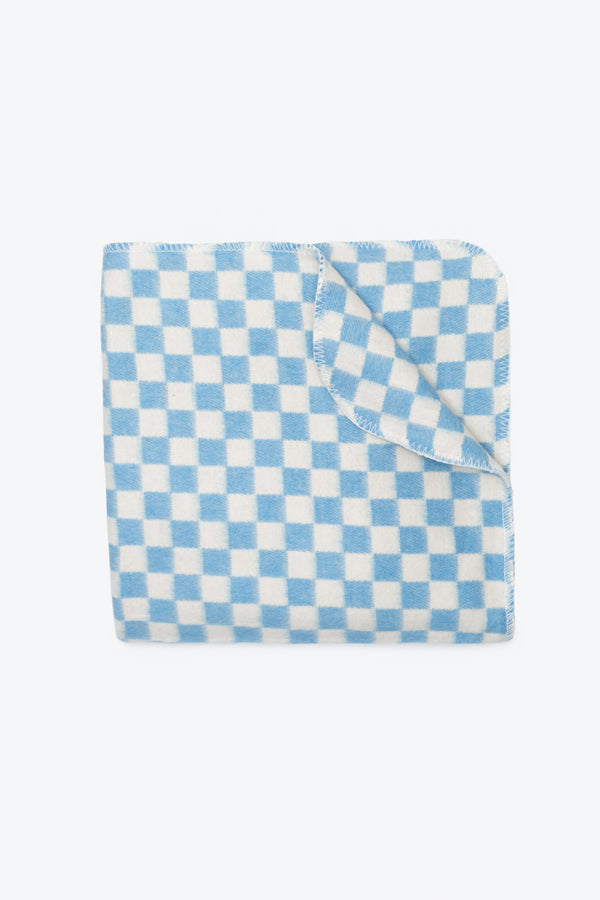 Folded children's blanket in light blue and white