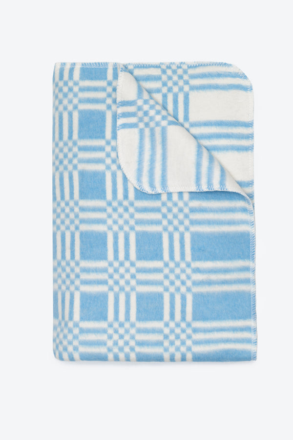 Folded blanket view in light blue and white