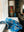 Blue mother and child blanket on a windowsill seat with a beautiful tall lamp with orange yellows and greens raffia like texture