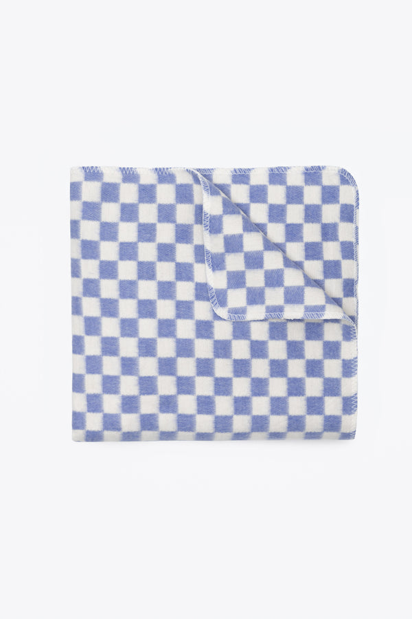 Checkered blue and white blanket folded on white background