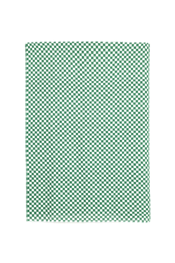 flay lay of green and white checkers on a cotton blanket